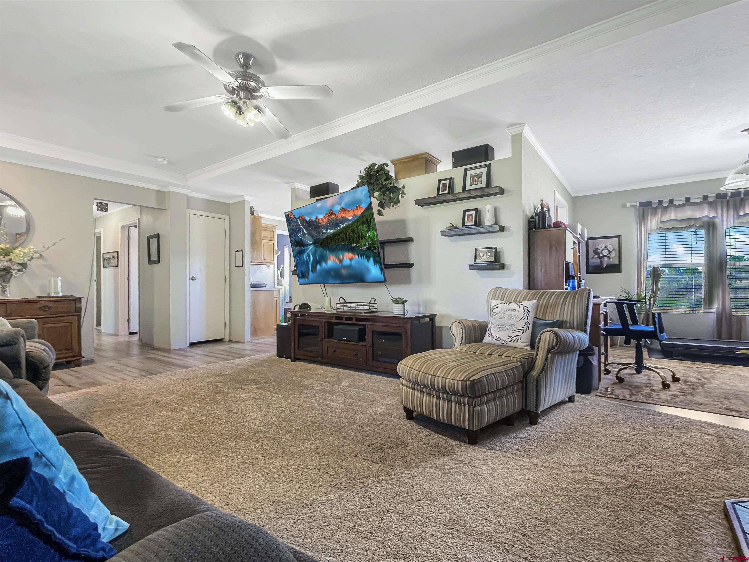 21043 Road C 7 Cortez Co 81321 Cortez, CO 81321 - Photo 7 of 40 a living room with furniture and a flat screen tv