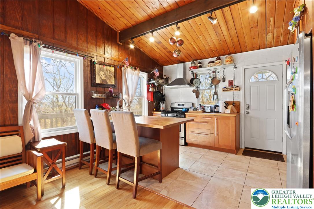 214 Mockingbird Court Bushkill, PA 18324 - Photo 12 of 40 a view of a dining room with furniture window and outside view