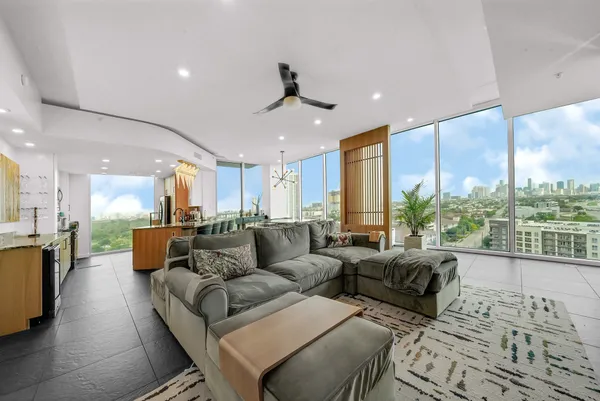 a living room with furniture and a large window