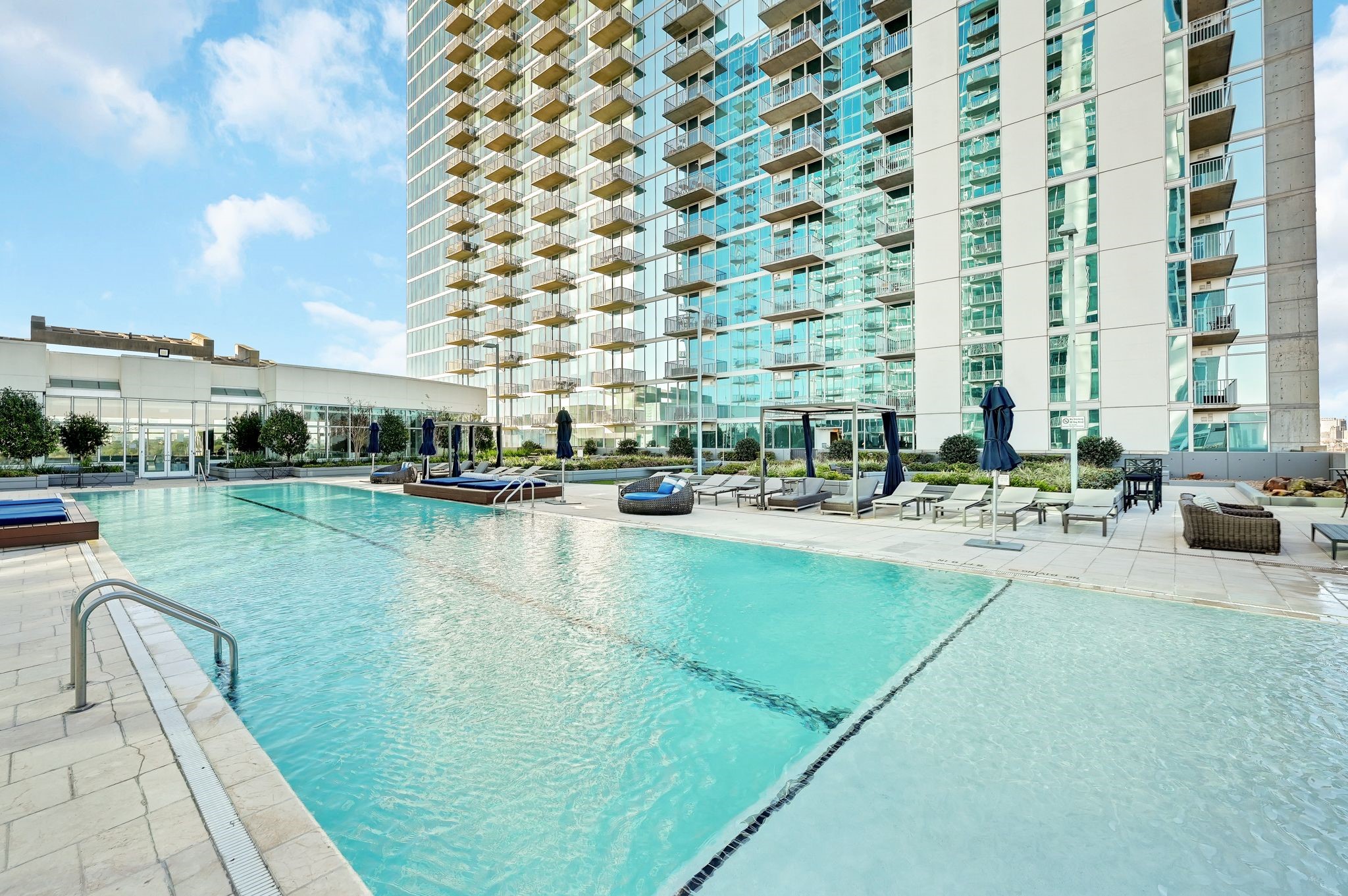 5925 Almeda Road, Unit 11317 Houston, TX 77004 - Photo 24 of 38 a swimming pool with outdoor seating and yard