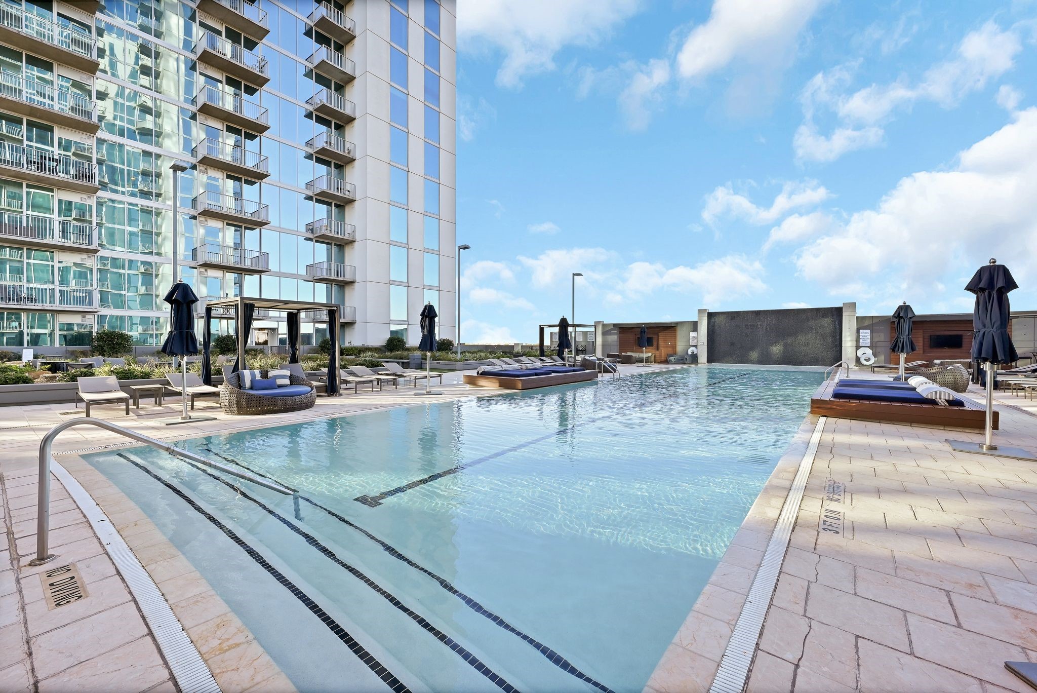 5925 Almeda Road, Unit 11317 Houston, TX 77004 - Photo 25 of 38 a view of a swimming pool with outdoor seating