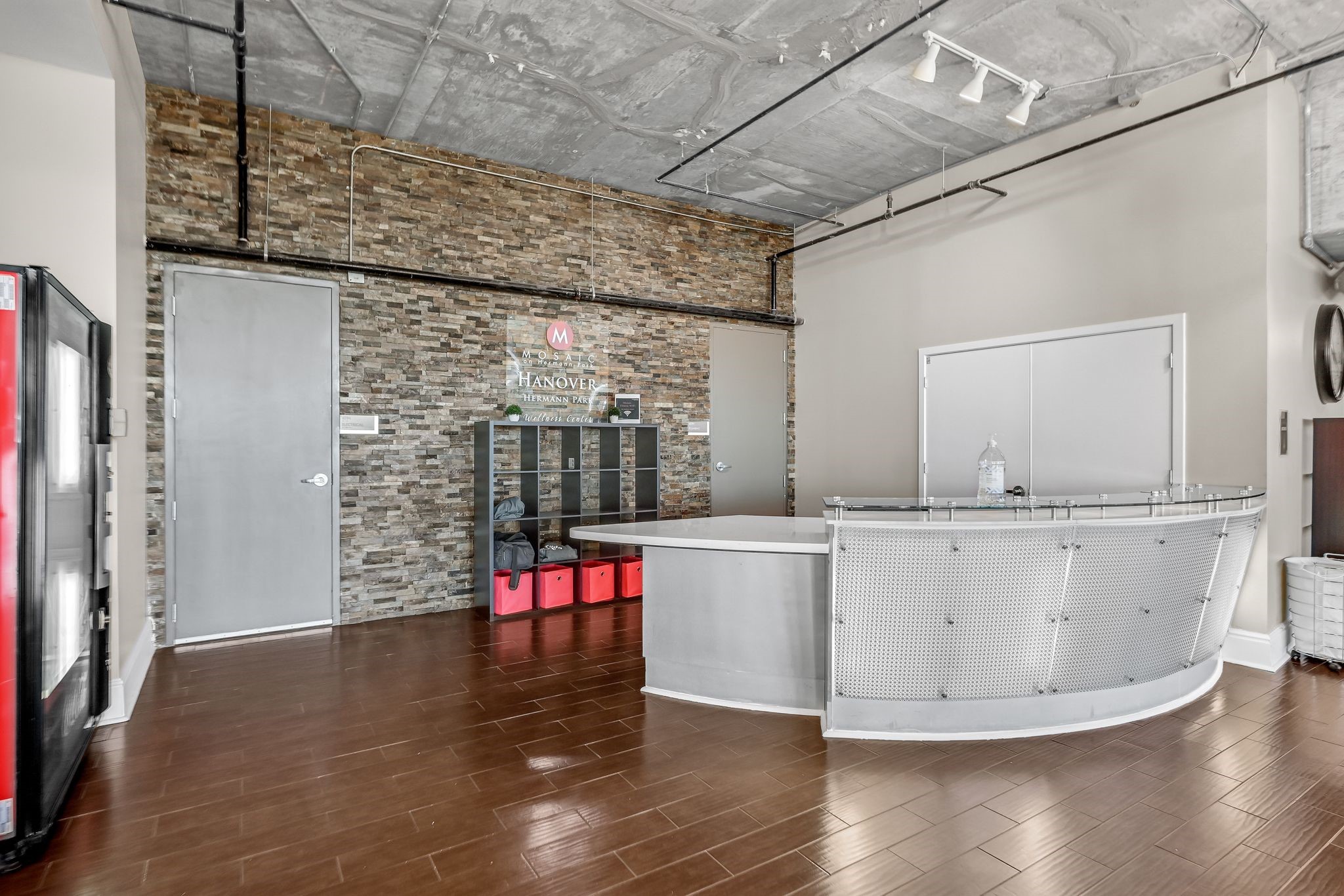 5925 Almeda Road, Unit 11317 Houston, TX 77004 - Photo 33 of 38 a view of a kitchen with wooden floors and a sink
