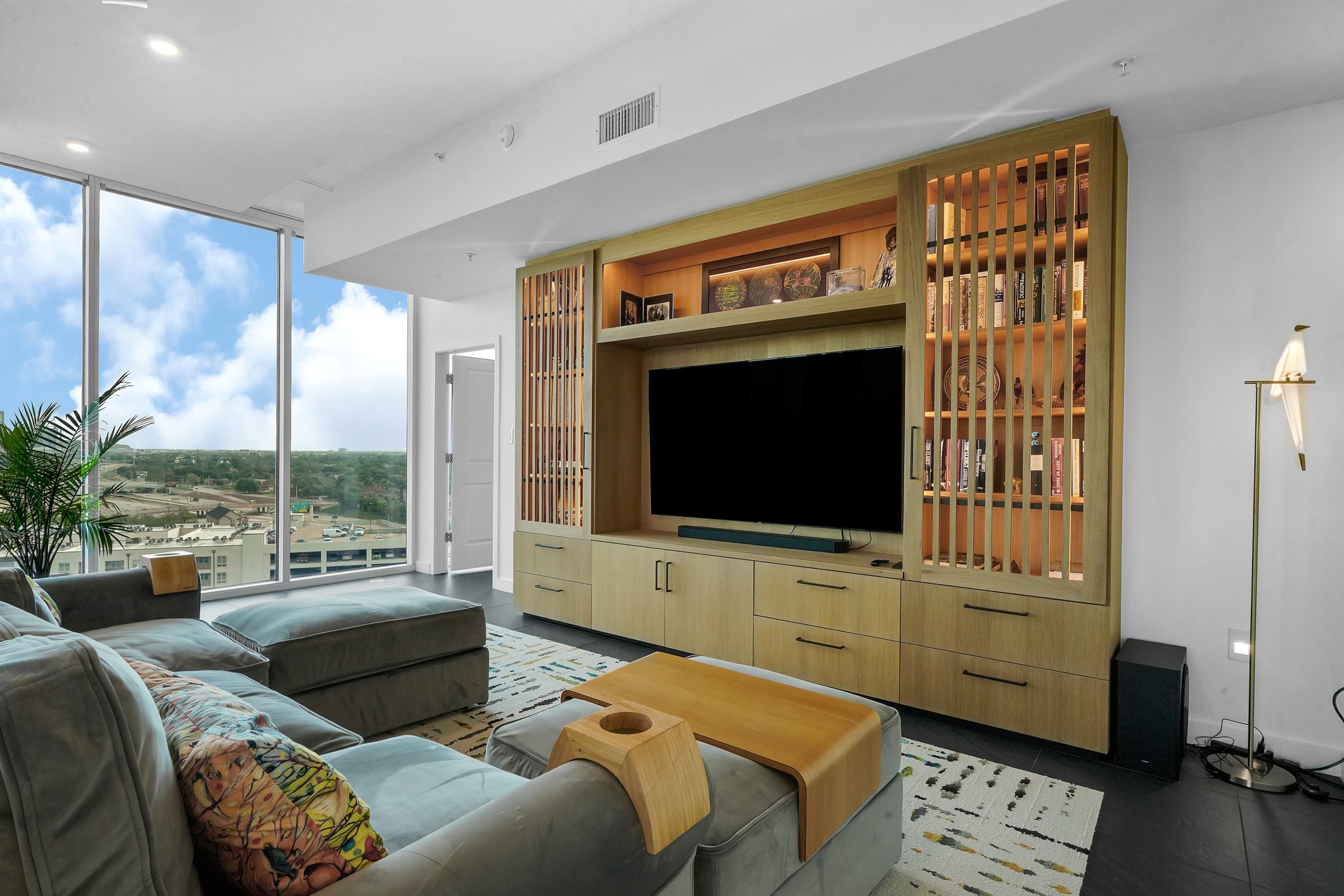 5925 Almeda Road, Unit 11317 Houston, TX 77004 - Photo 4 of 38 a living room with furniture and a flat screen tv