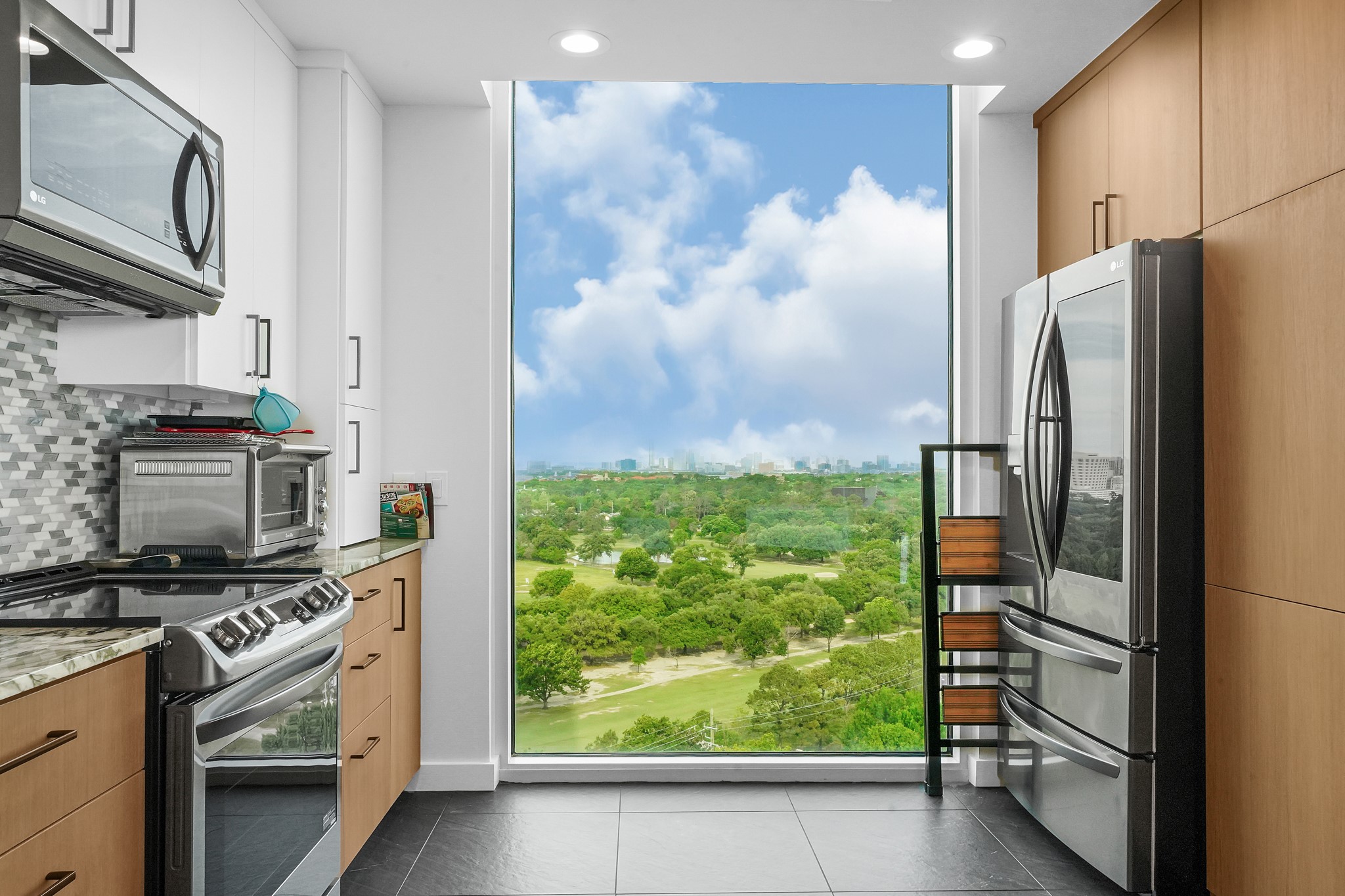 5925 Almeda Road, Unit 11317 Houston, TX 77004 - Photo 8 of 38 a kitchen with stainless steel appliances granite countertop a refrigerator and a stove