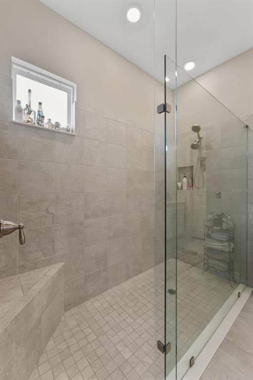 4951 Freccia Loop Wesley Chapel, FL 33543 - Photo 22 of 43 a bathroom with a shower