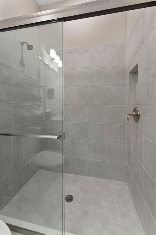 4951 Freccia Loop Wesley Chapel, FL 33543 - Photo 32 of 43 a bathroom with a shower