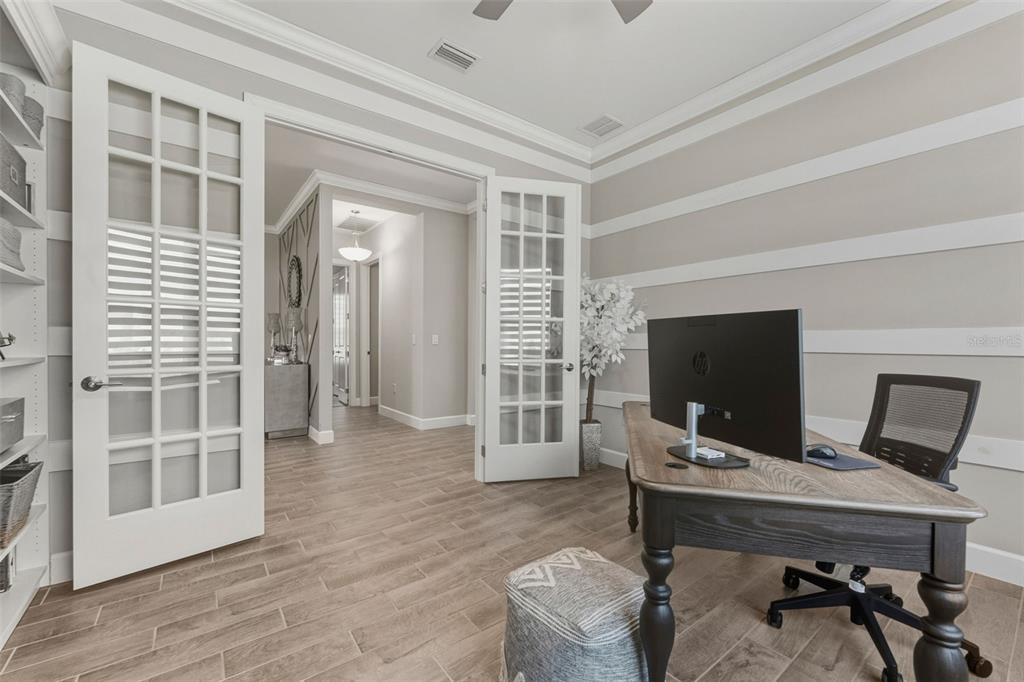 4951 Freccia Loop Wesley Chapel, FL 33543 - Photo 34 of 43 a view of a livingroom with furniture and a flat screen tv