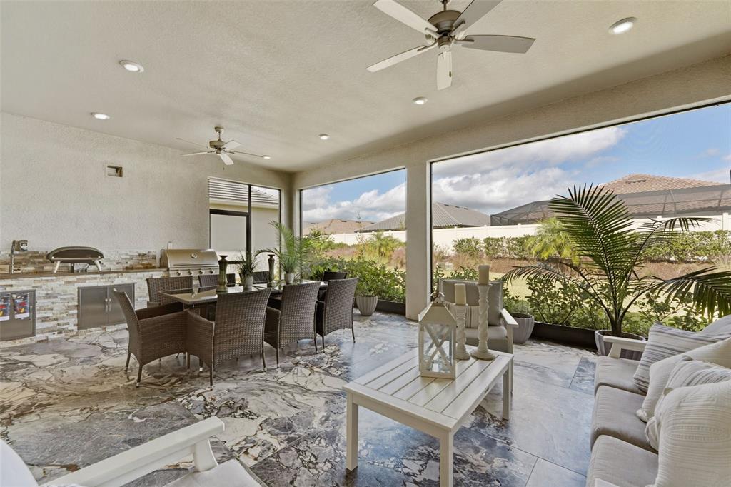 4951 Freccia Loop Wesley Chapel, FL 33543 - Photo 38 of 43 a living room with furniture and a large window
