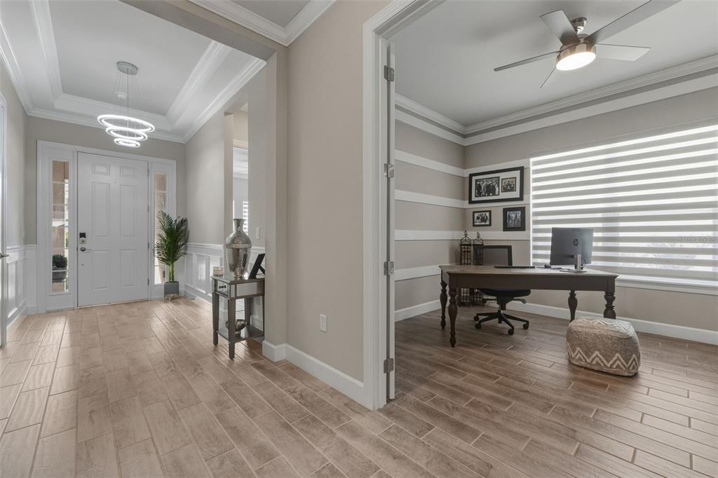 4951 Freccia Loop Wesley Chapel, FL 33543 - Photo 6 of 43 a view of a livingroom with workspace and a window