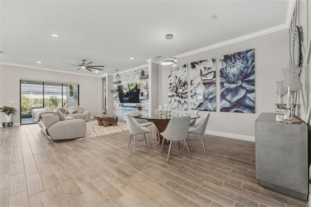 4951 Freccia Loop Wesley Chapel, FL 33543 - Photo 10 of 43 a dining room with furniture and wooden floor