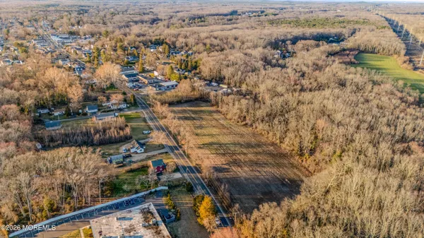a view of residential houses with wooden fence