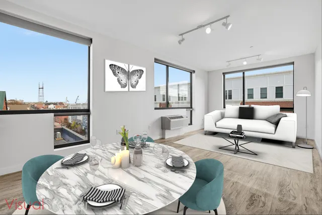 a living room with furniture and a table