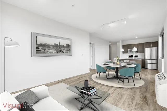 a living room with dining table and chairs