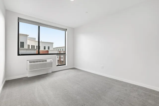 an empty room with a bathroom