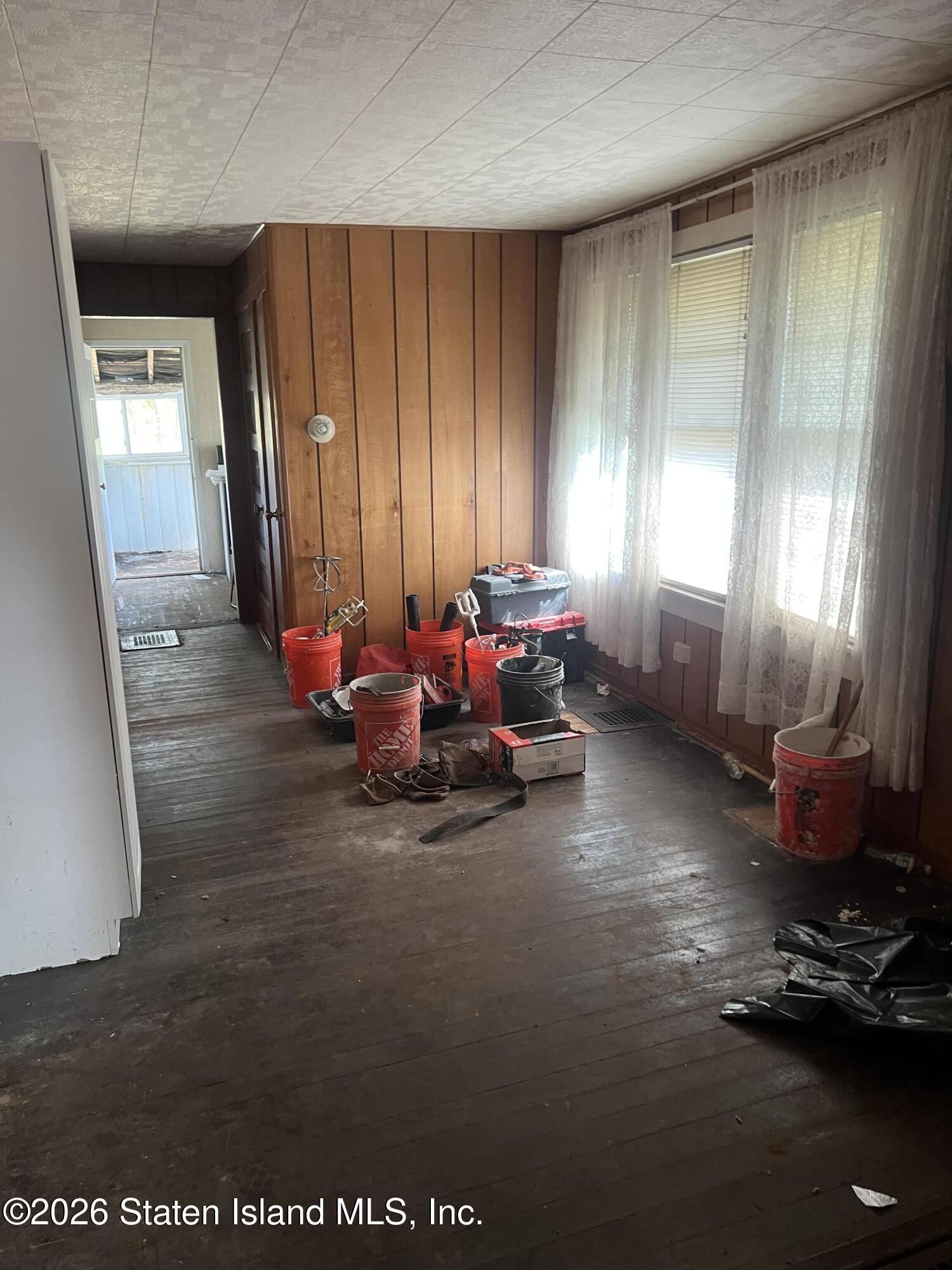634 Drumgoole Road East Staten Island, NY 10312 - Photo 5 of 10 a living room with furniture and a window