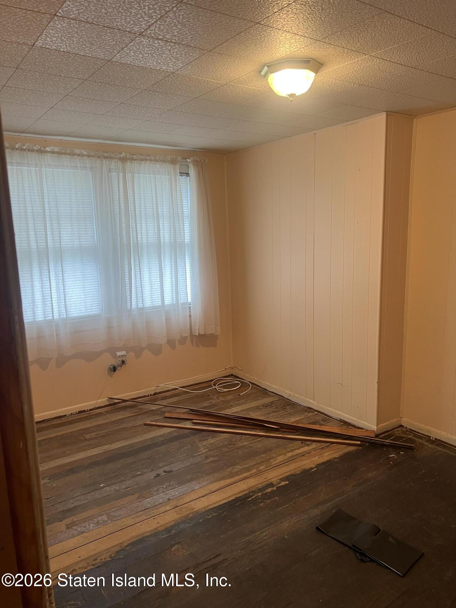 634 Drumgoole Road East Staten Island, NY 10312 - Photo 6 of 10 a view of a livingroom with stairs
