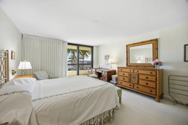 a bedroom with a bed and a dresser in it