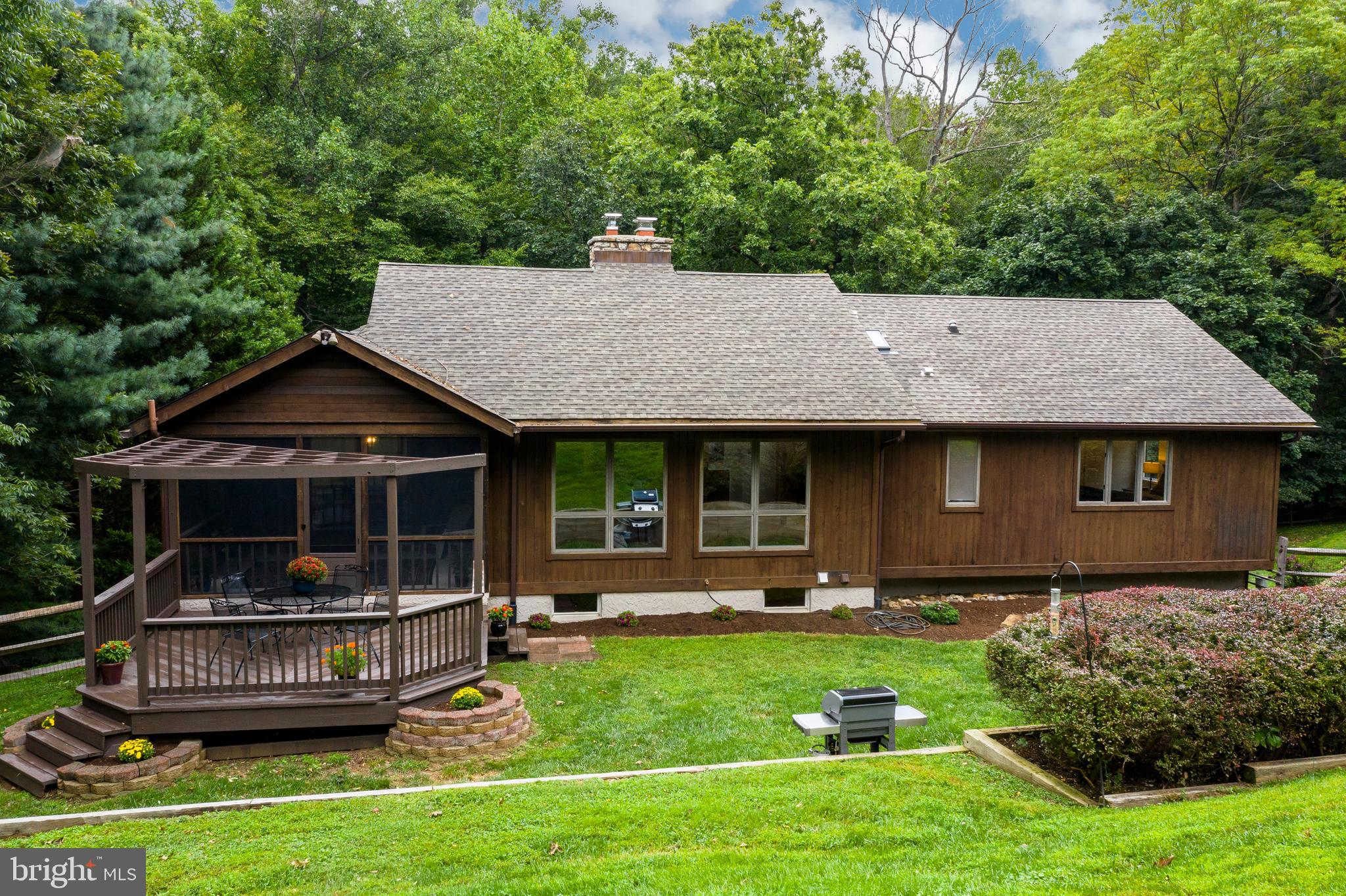 98 Birmingham Road West Chester, PA 19382 - Photo 43 of 43 Rear View of yard, deck and covered porch