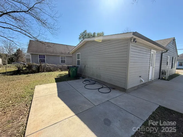 a view of a backyard with sitting area