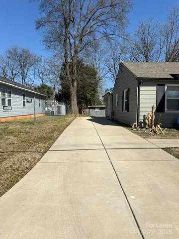 a house with yard in front of it