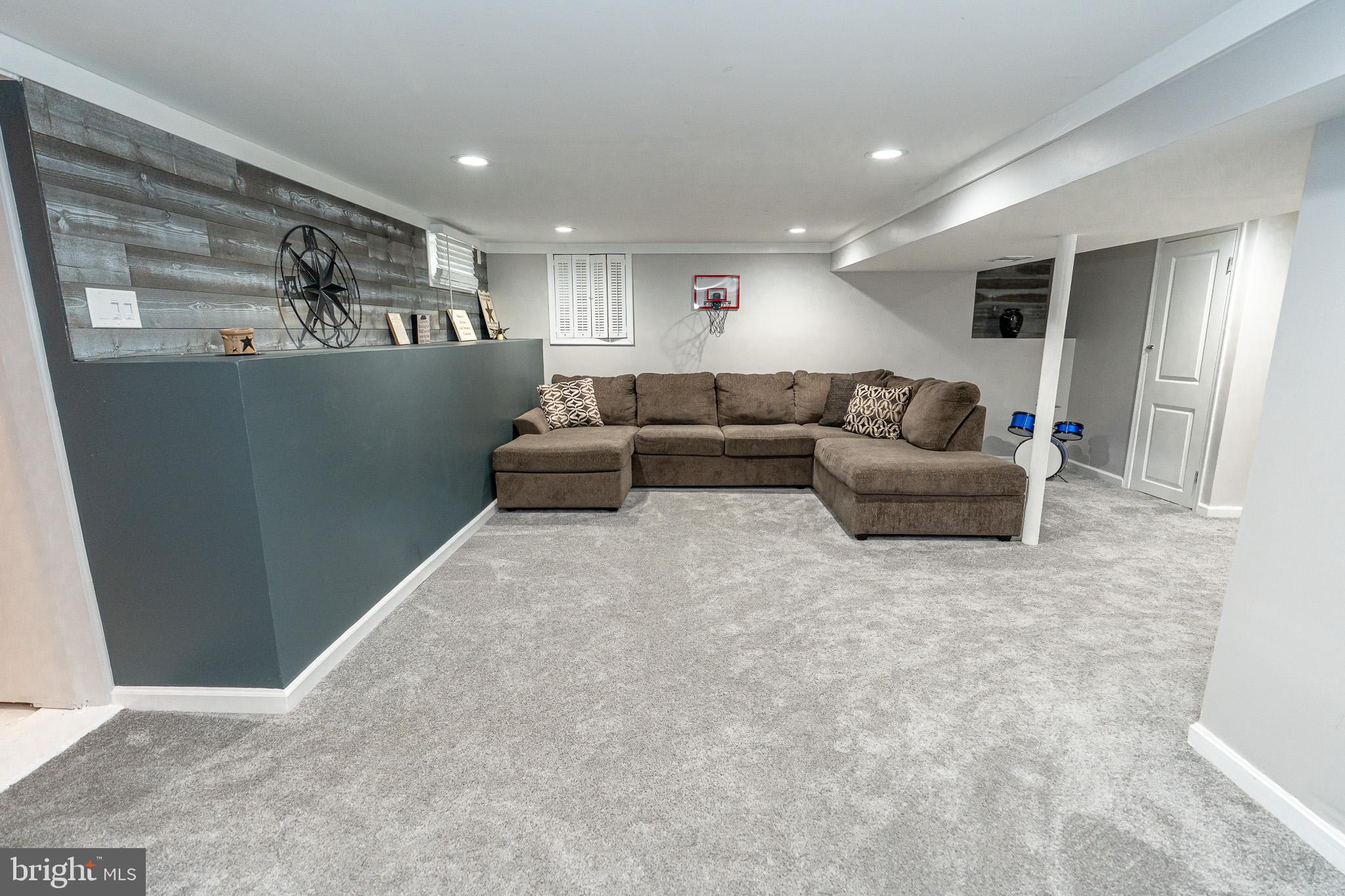 220 Pinewood Road Baltimore, MD 21222 - Photo 27 of 45 a living room with furniture and a flat screen tv