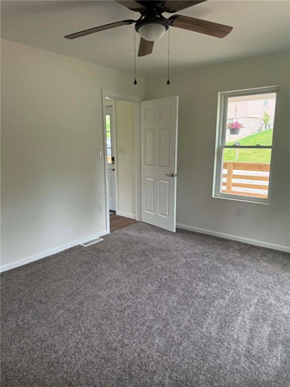 89 Old 51 Road Perryopolis, PA 15473 - Photo 12 of 45 an empty room with a window and a fan