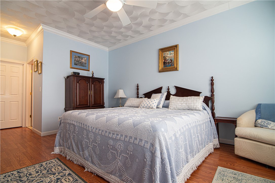 4 Asylum Road, Unit H North Providence, RI 02904 - Photo 26 of 45 There is a Walk in Closet + Another Large Closet & en Suite Bathroom. Room is Accented with Crown Moulding.