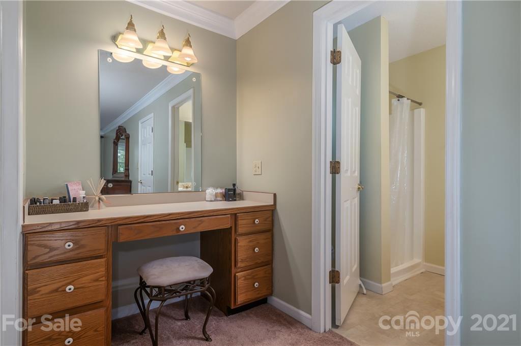 163 Fairforest Drive Rutherfordton, NC 28139 - Photo 20 of 48 a spacious bathroom with a granite countertop sink a toilet and a mirror