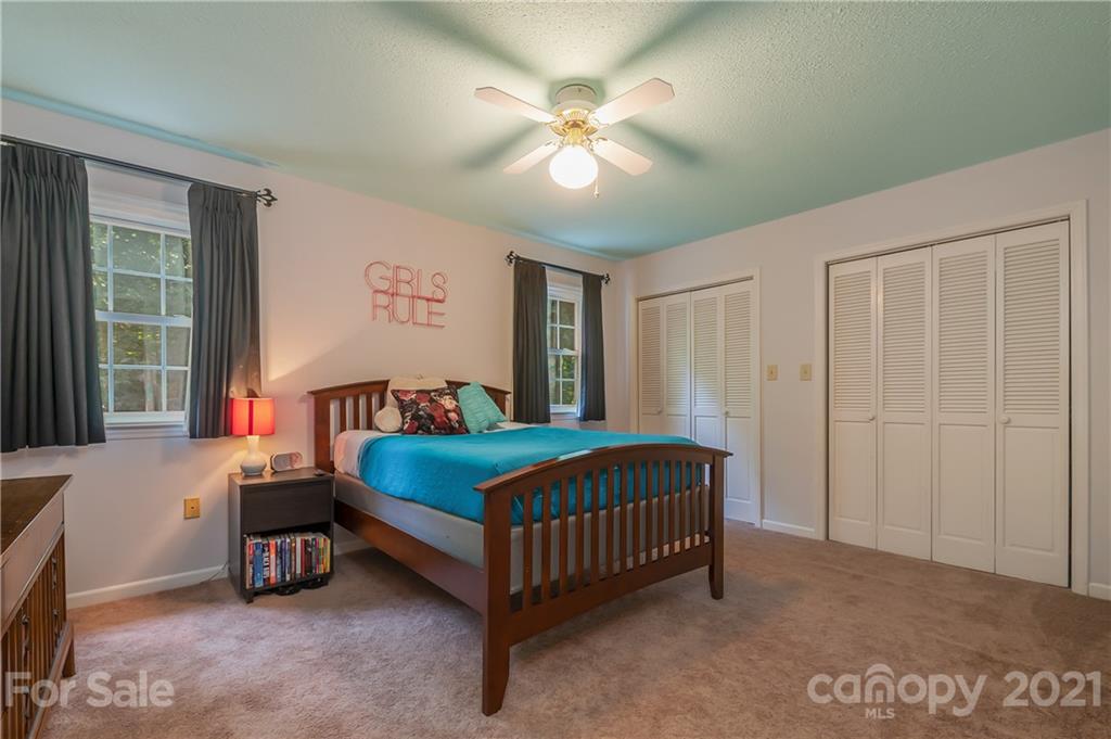 163 Fairforest Drive Rutherfordton, NC 28139 - Photo 24 of 48 a bedroom with a bed and a ceiling fan