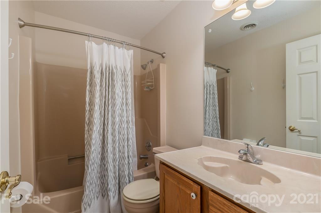 163 Fairforest Drive Rutherfordton, NC 28139 - Photo 28 of 48 a bathroom with a sink toilet vanity and shower