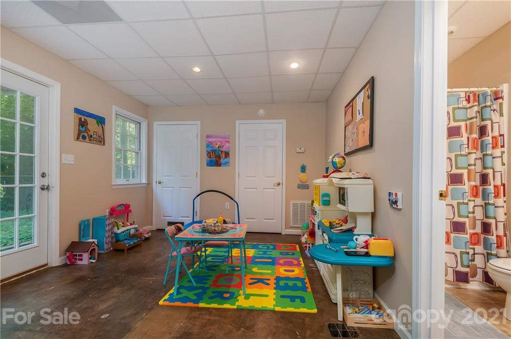 163 Fairforest Drive Rutherfordton, NC 28139 - Photo 32 of 48 a room with furniture a rug toys and a window