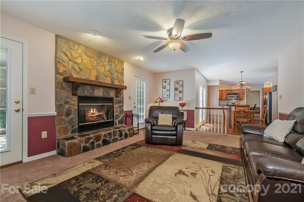 163 Fairforest Drive Rutherfordton, NC 28139 - Photo 5 of 48 a living room with furniture a flat screen tv and a fireplace