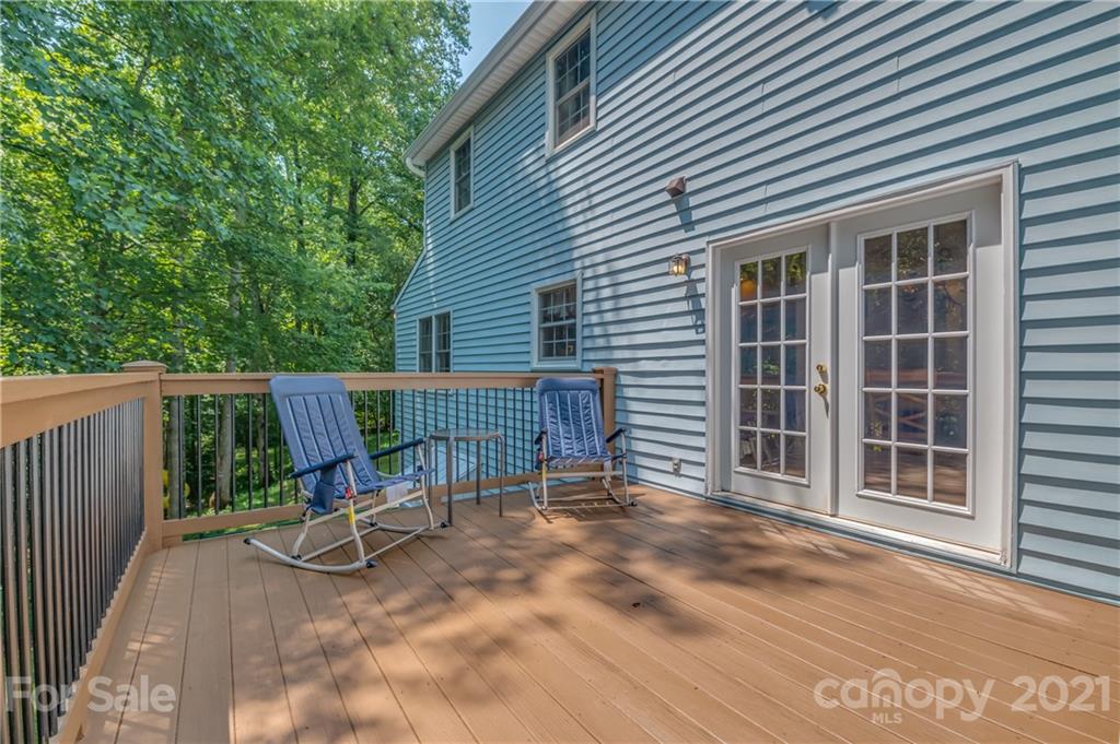 163 Fairforest Drive Rutherfordton, NC 28139 - Photo 42 of 48 a view of a chair and table in the back yard of the house