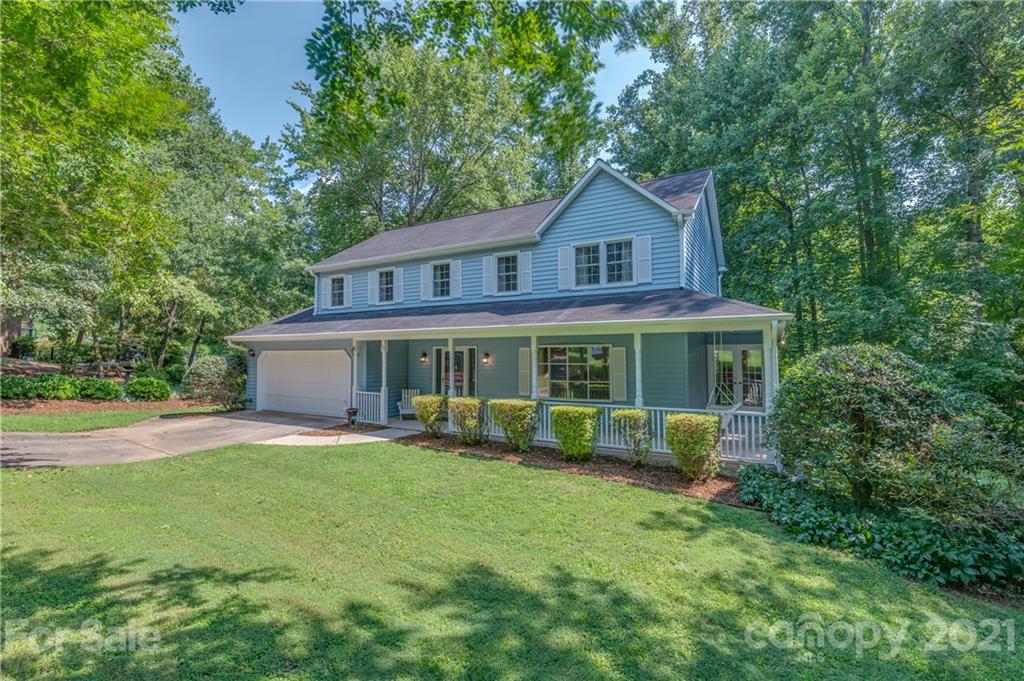 163 Fairforest Drive Rutherfordton, NC 28139 - Photo 47 of 48 a front view of a house with a yard and potted plants