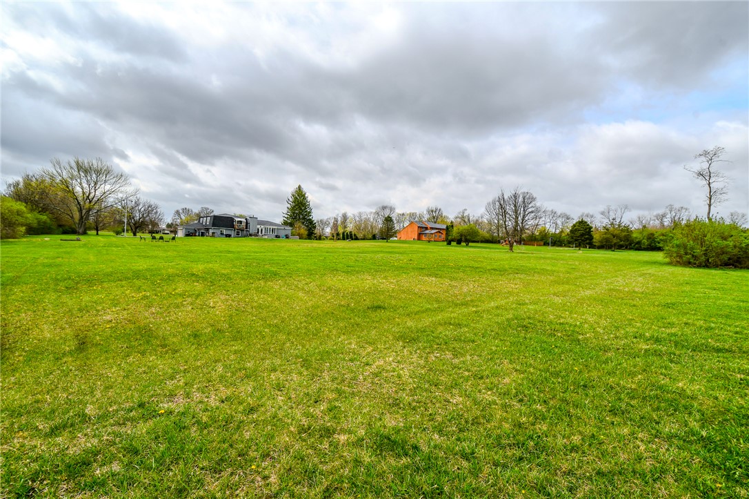 6169 Dayton Farmersville Road Dayton, OH 45417 - Photo 56 of 64 Expansive green yard with ample space for outdoor enjoyment and picturesque views.