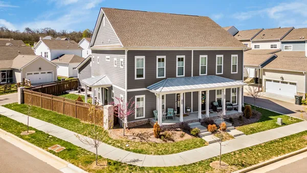 front view of a house with a small yard