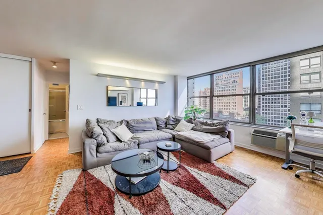 a living room with furniture and a large window