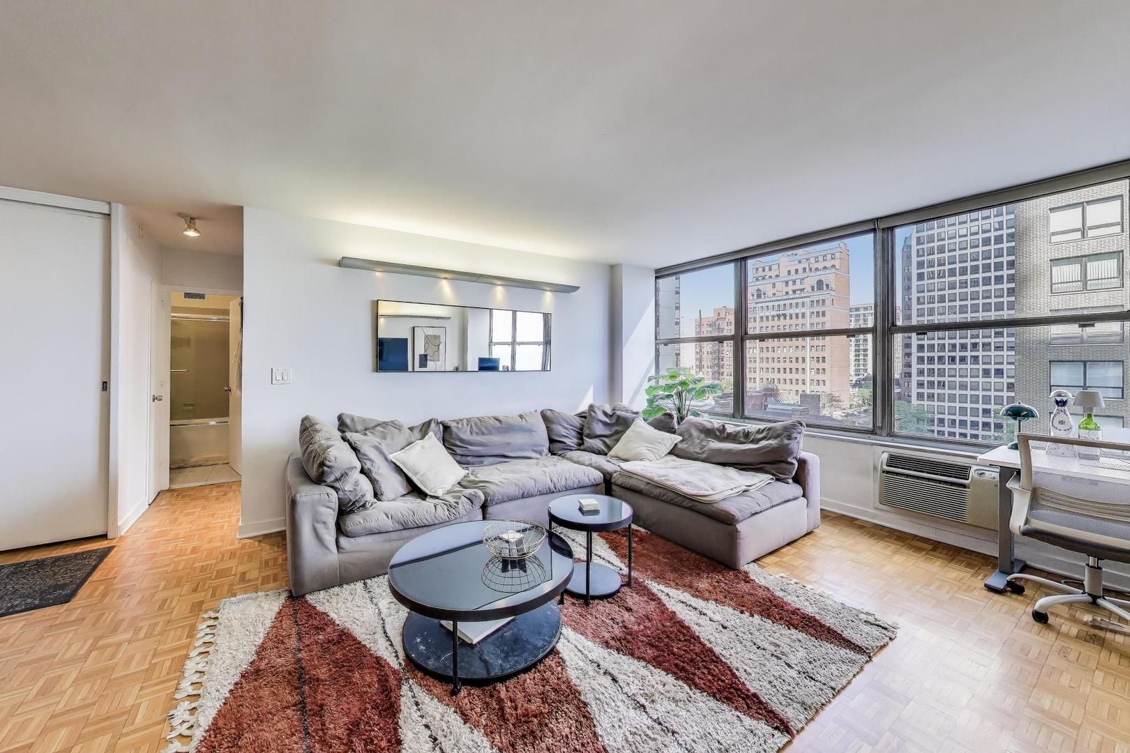 1000 North Lake Shore Plaza, Unit 804 Chicago, IL 60611 - Photo 13 of 25 a living room with furniture and a large window