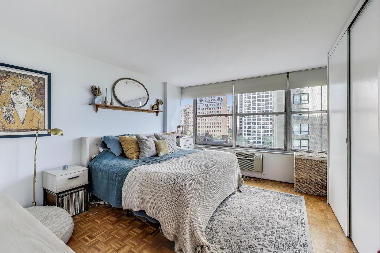 1000 North Lake Shore Plaza, Unit 804 Chicago, IL 60611 - Photo 14 of 25 a bedroom with a bed and a large window