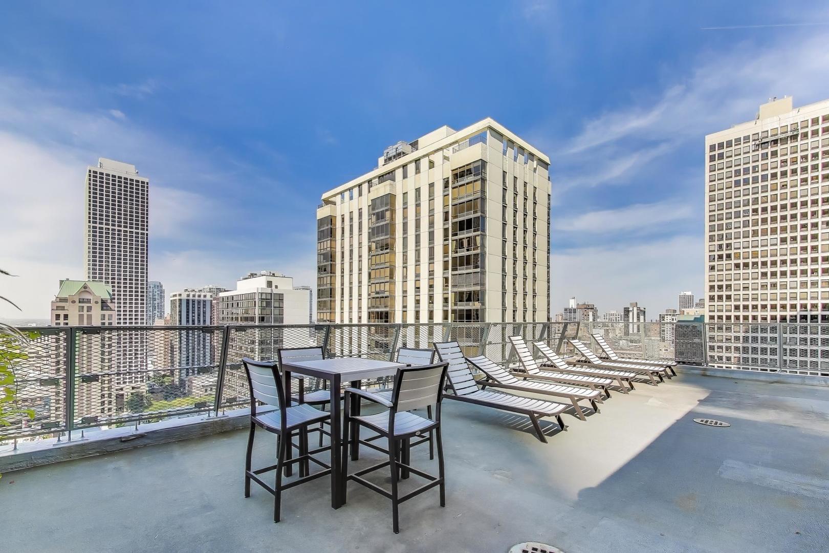 1000 North Lake Shore Plaza, Unit 804 Chicago, IL 60611 - Photo 18 of 25 a view of balcony with two chairs and a table