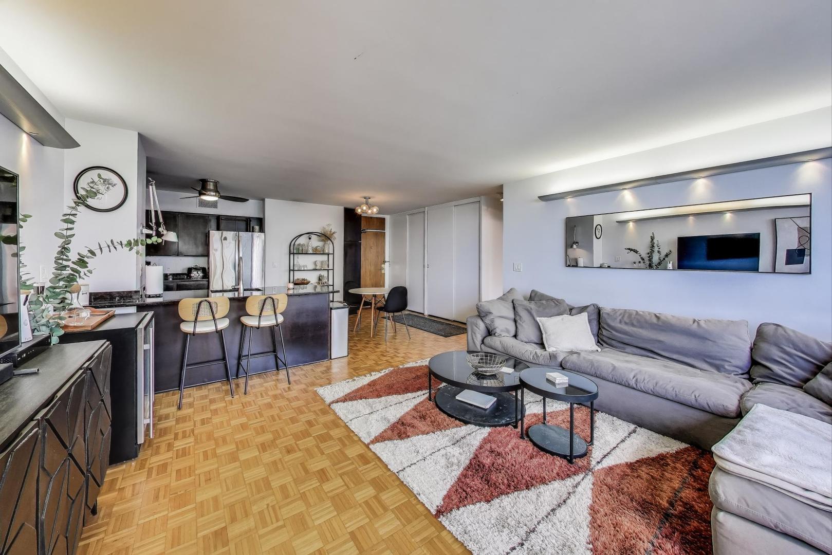 1000 North Lake Shore Plaza, Unit 804 Chicago, IL 60611 - Photo 21 of 25 a living room with furniture and a wooden floor