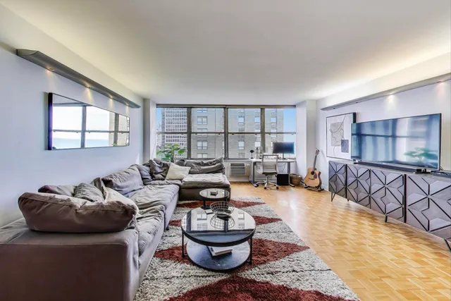 a living room with furniture and a rug