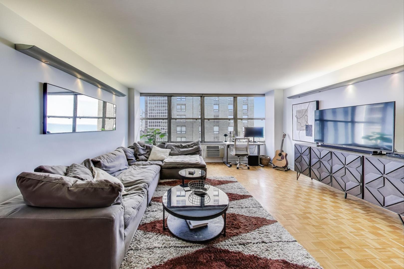 1000 North Lake Shore Plaza, Unit 804 Chicago, IL 60611 - Photo 6 of 25 a living room with furniture and a rug