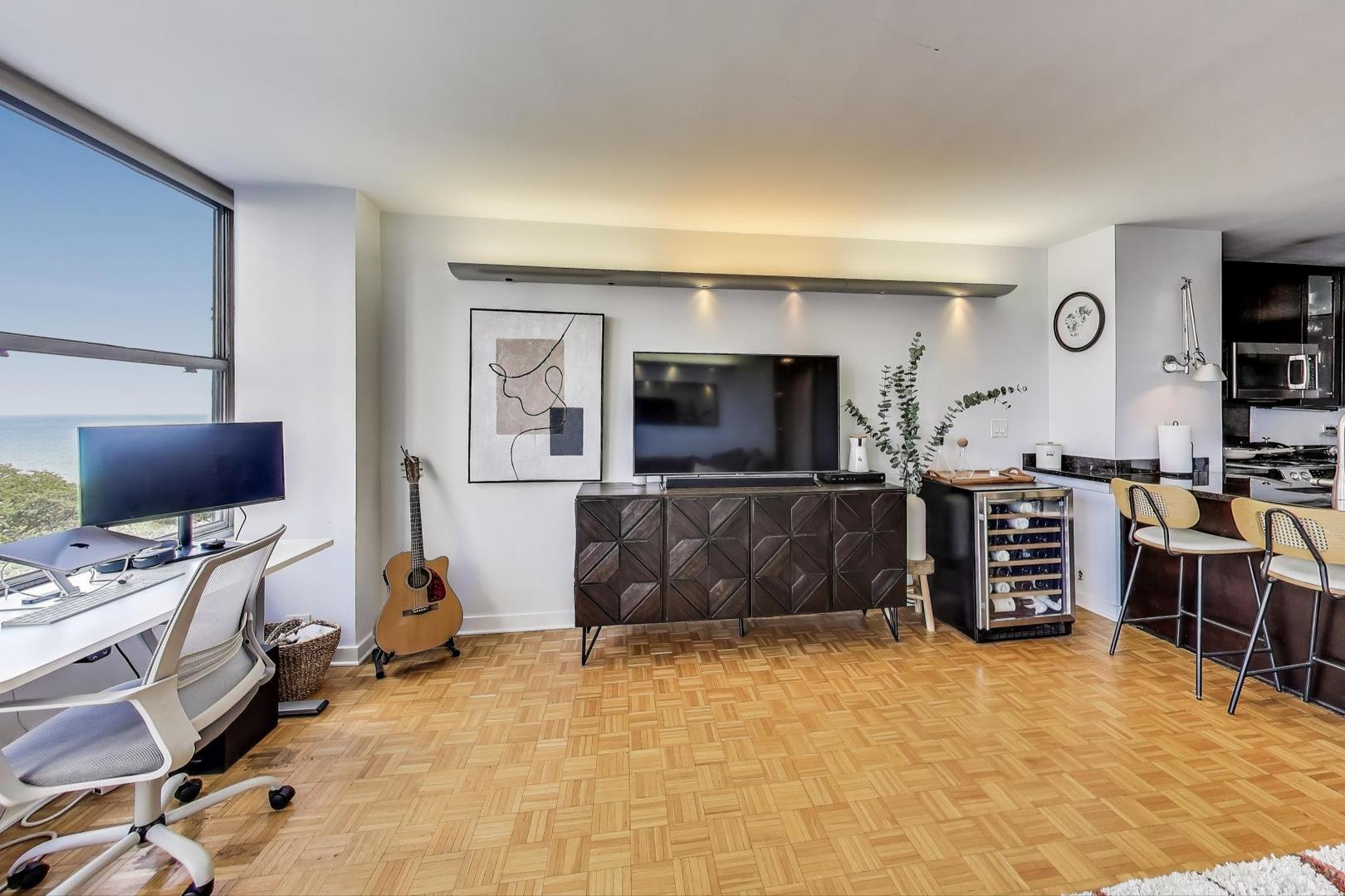 1000 North Lake Shore Plaza, Unit 804 Chicago, IL 60611 - Photo 7 of 25 a living room with furniture and a flat screen tv