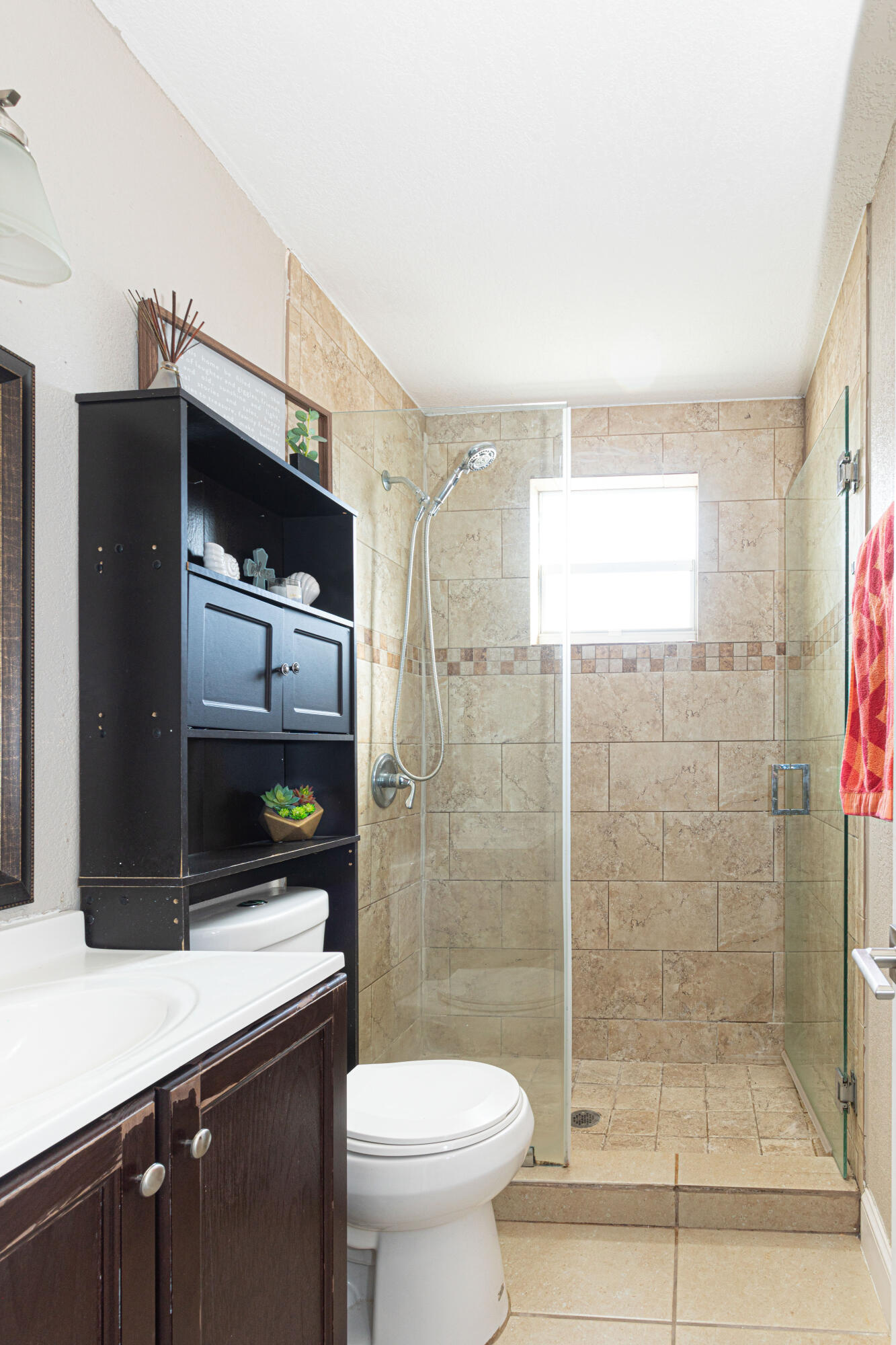 740 Aspen Road West Palm Beach, FL 33409 - Photo 21 of 34 a bathroom with a shower a toilet and a sink