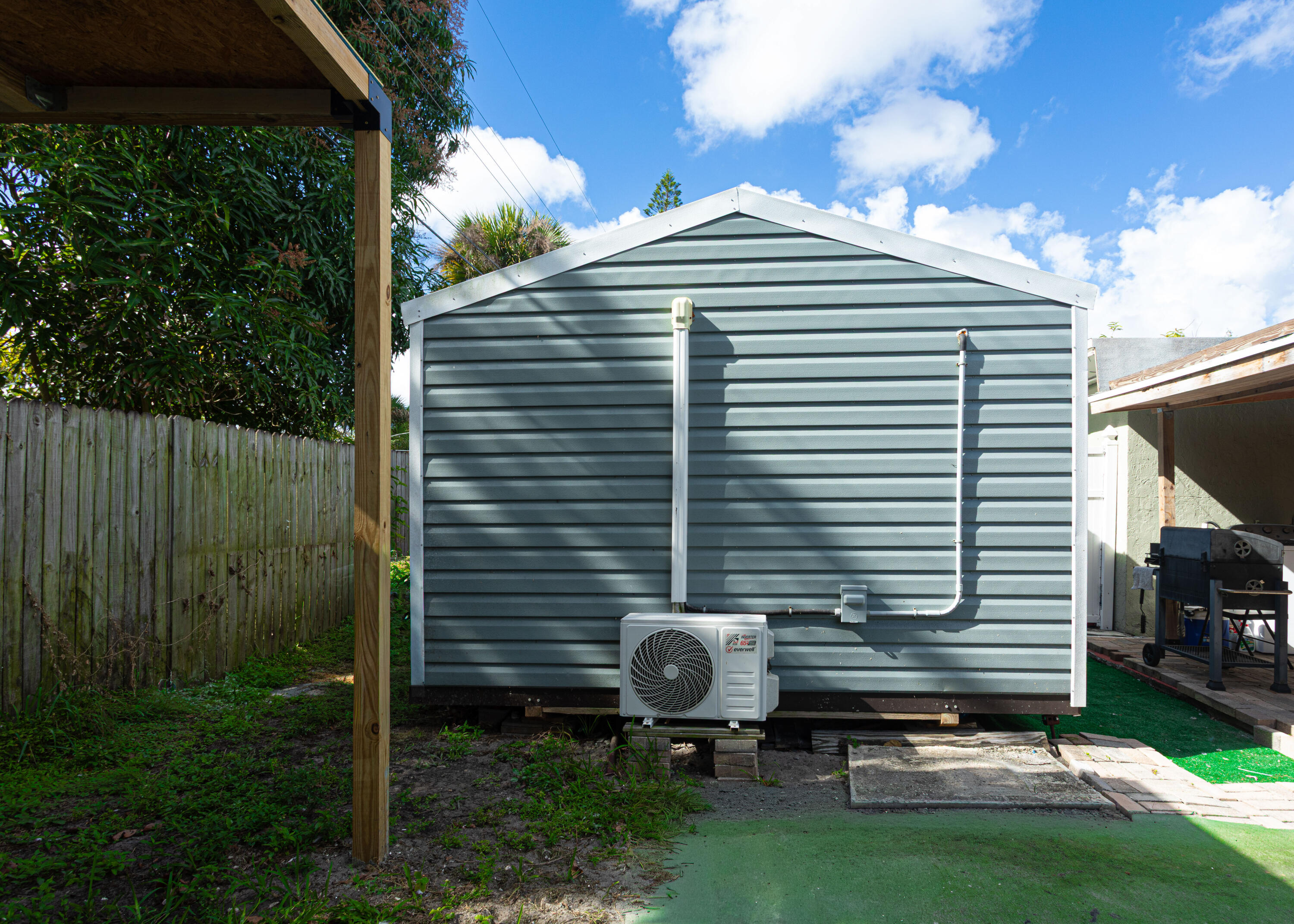 740 Aspen Road West Palm Beach, FL 33409 - Photo 26 of 34 a front view of a house with a garden