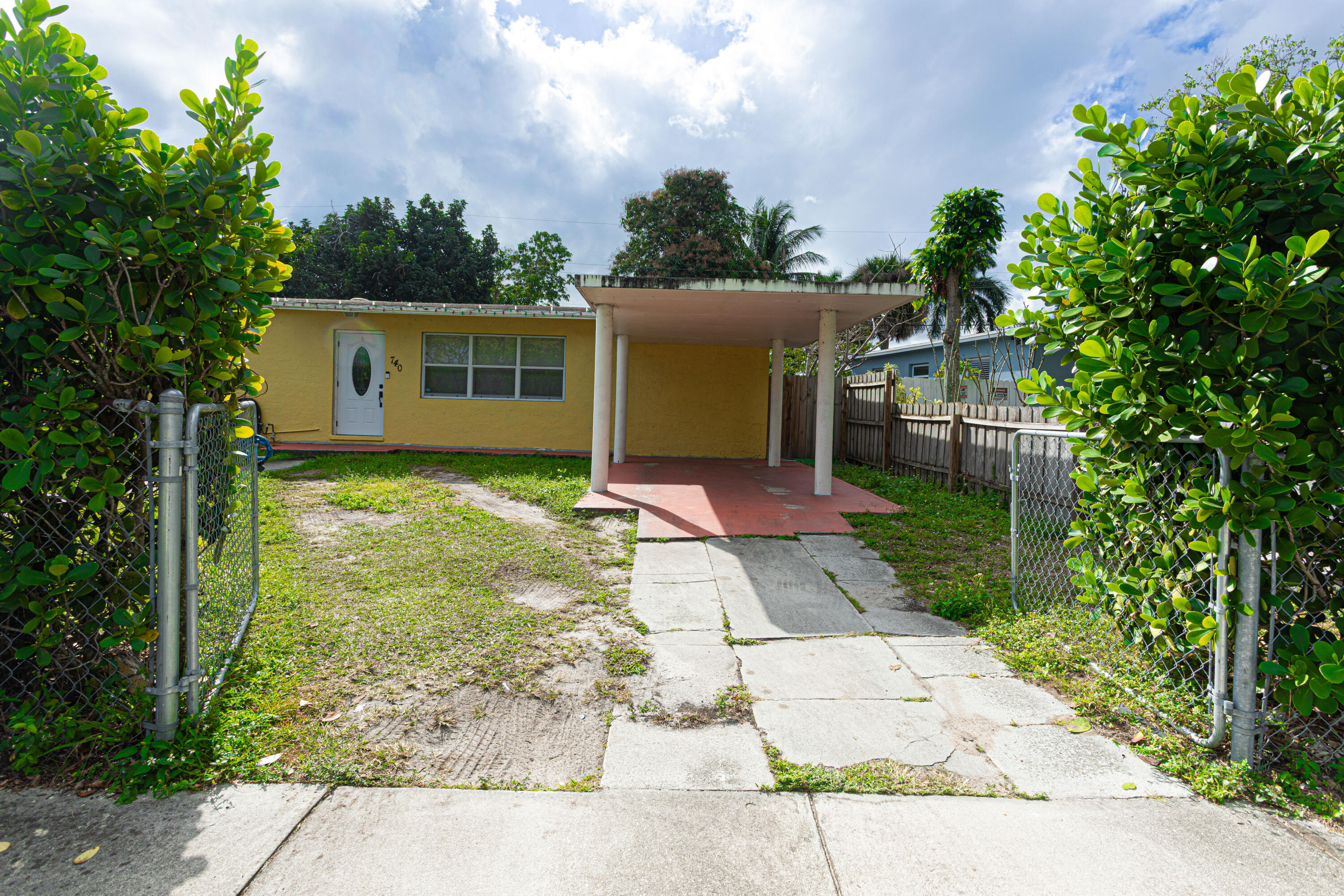 740 Aspen Road West Palm Beach, FL 33409 - Photo 5 of 34 a view of a house with a yard