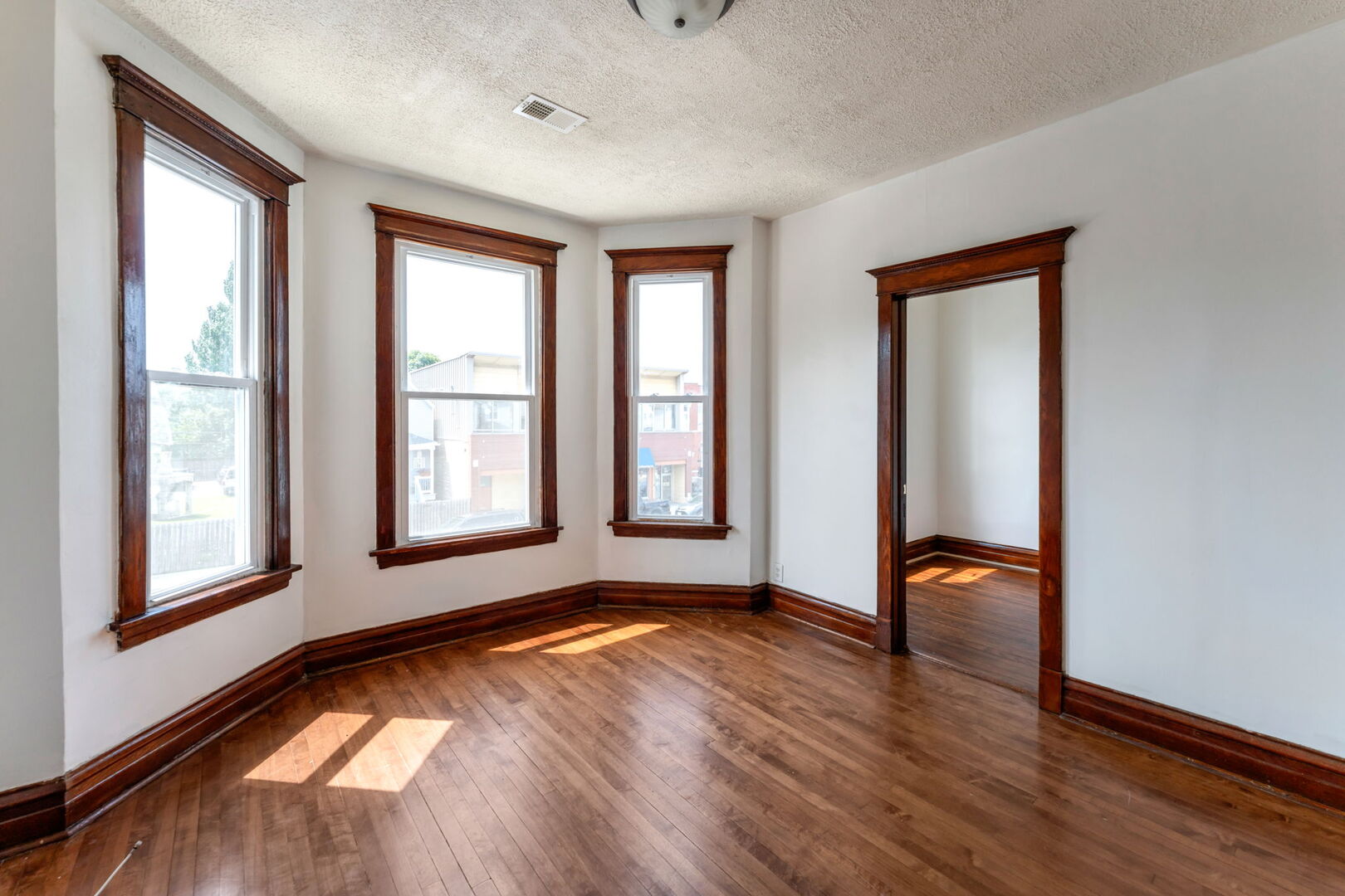1921 North Pulaski Road, Unit 2 Chicago, IL 60639 - Photo 3 of 15 a view of room with window and wooden floor