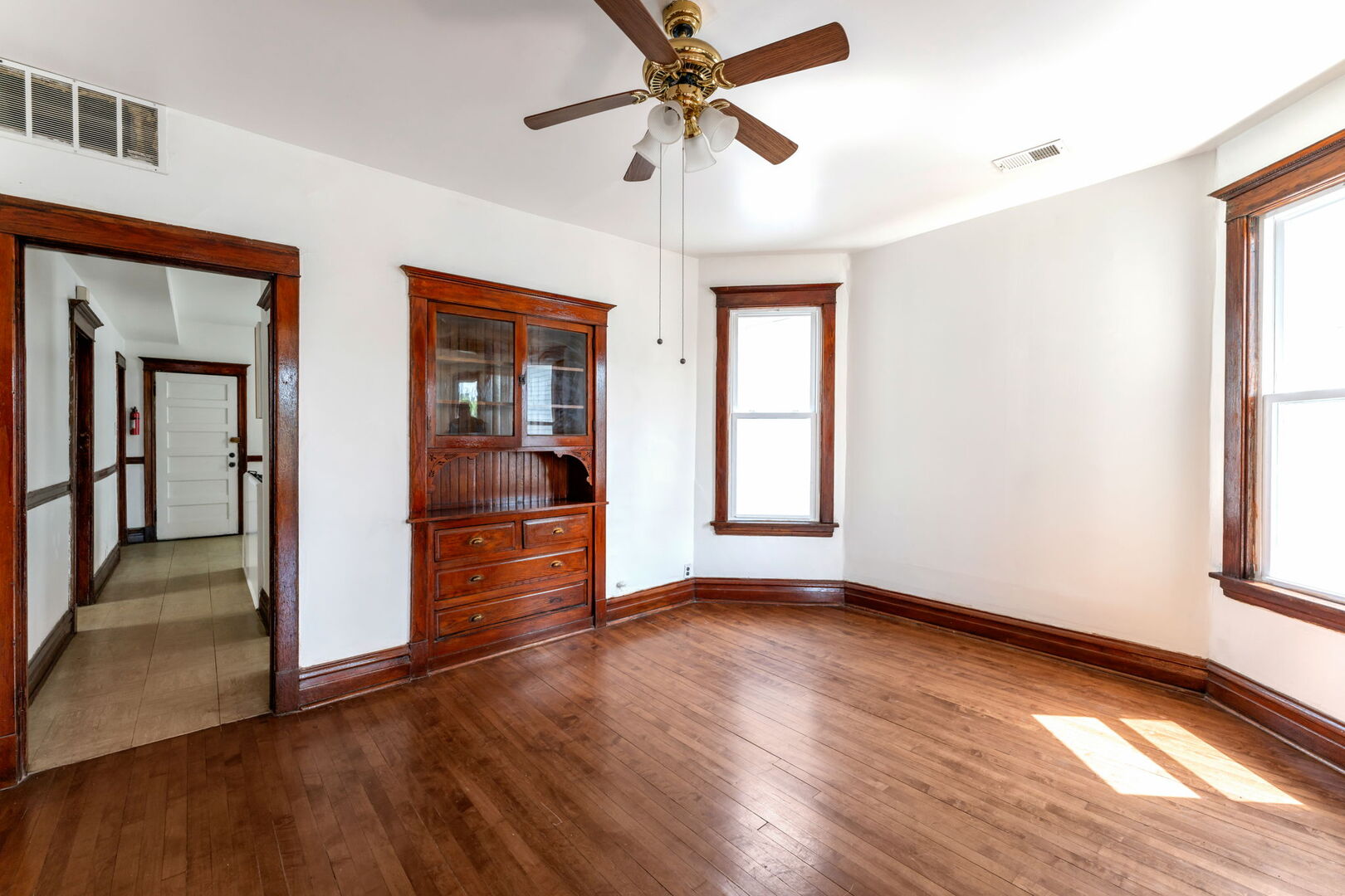 1921 North Pulaski Road, Unit 2 Chicago, IL 60639 - Photo 4 of 15 wooden floor in an empty room with a window