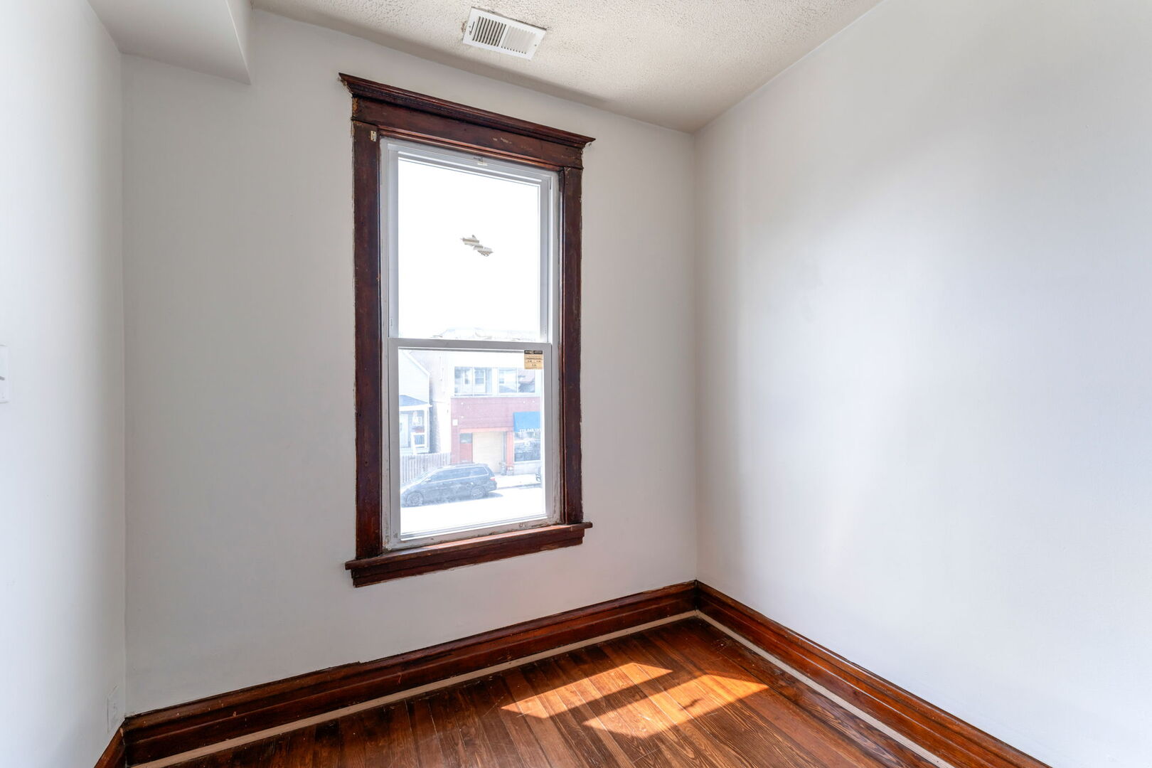 1921 North Pulaski Road, Unit 2 Chicago, IL 60639 - Photo 6 of 15 an empty room with window